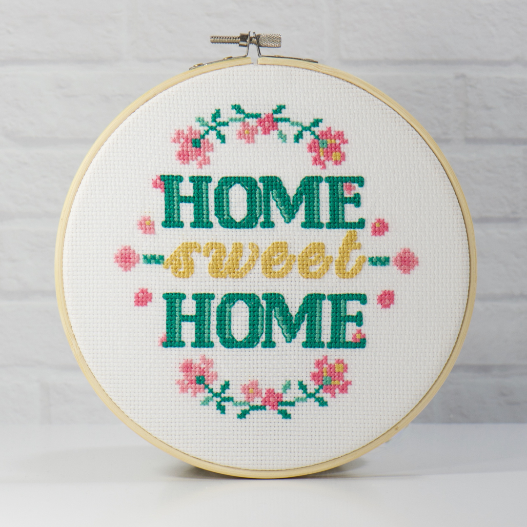 home sweet home saying counted cross stitch kit with pink floral vines in wood hoop
