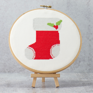 christmas red stocking with poinsettia flower on this modern cross stitch complete kit