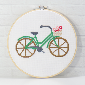 pink and rose flower basket on a green bicycle in cross stitch pattern digital download