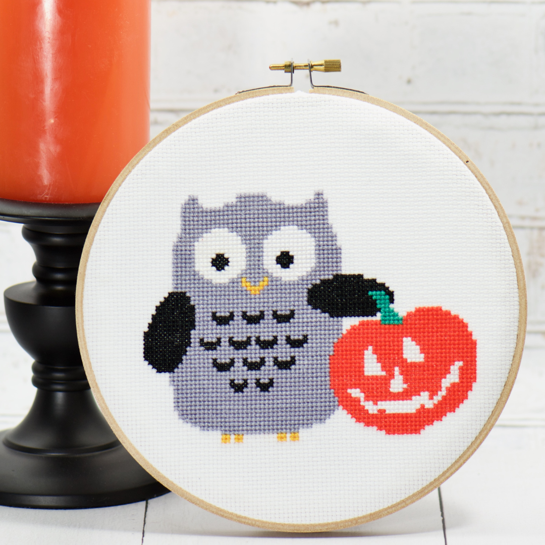halloween grey owl holding orange smiling pumpkin cross stitch complete kit