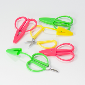 travel scissors in pink, green and yellow embroidery supplies for cross stitching