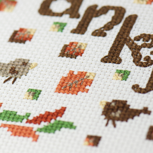 falling leaves of orange and golden on thankful thanksgiving counted cross stitch project