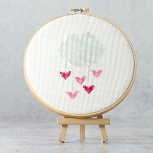 pink and rose hearts dripping from a silver cloud on this simple cross stitch pattern