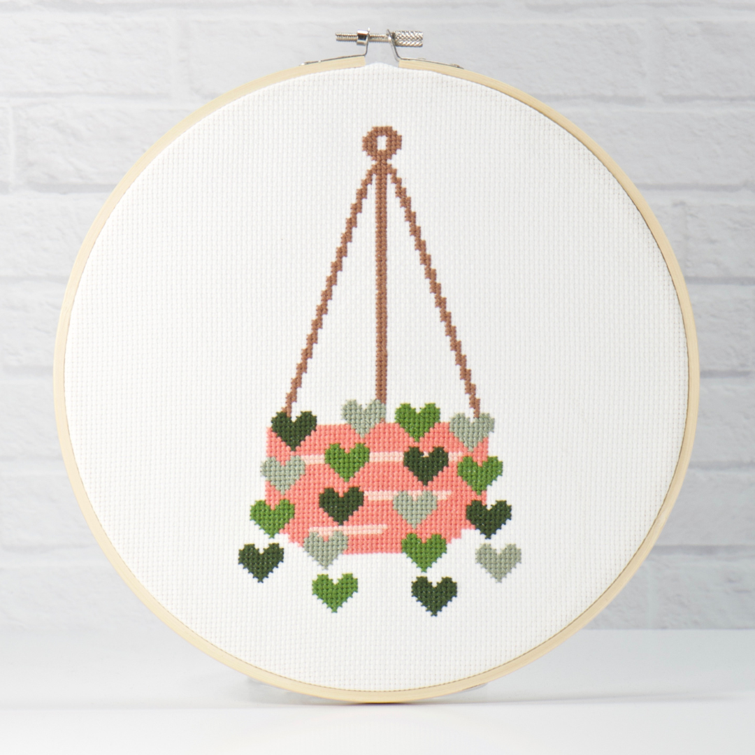 green hearts hanging from orange plant basket cross stitch pattern